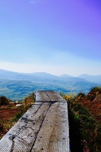 View of mountain range against blue sky