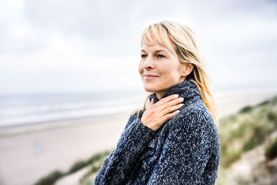 Smiling woman at the sea