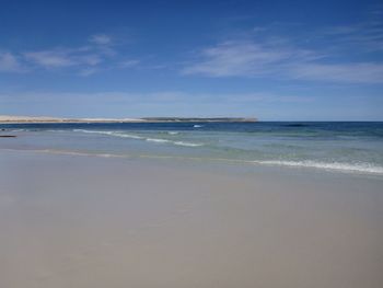 Scenic view of sea against blue sky