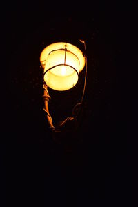 Low angle view of illuminated light bulb