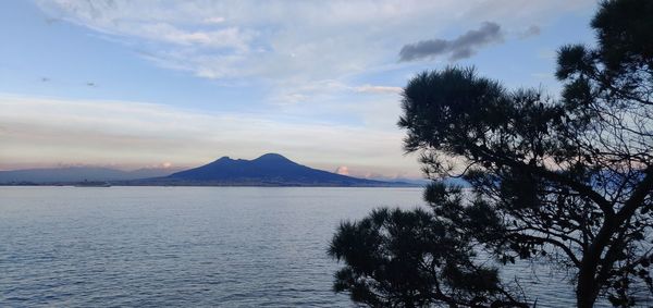 Scenic view of sea and vesuvio against sky during sunrise or sunset
