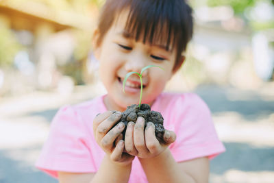 Close-up portrait of a girl holding ice cream