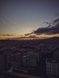 High angle view of city against sky during sunset