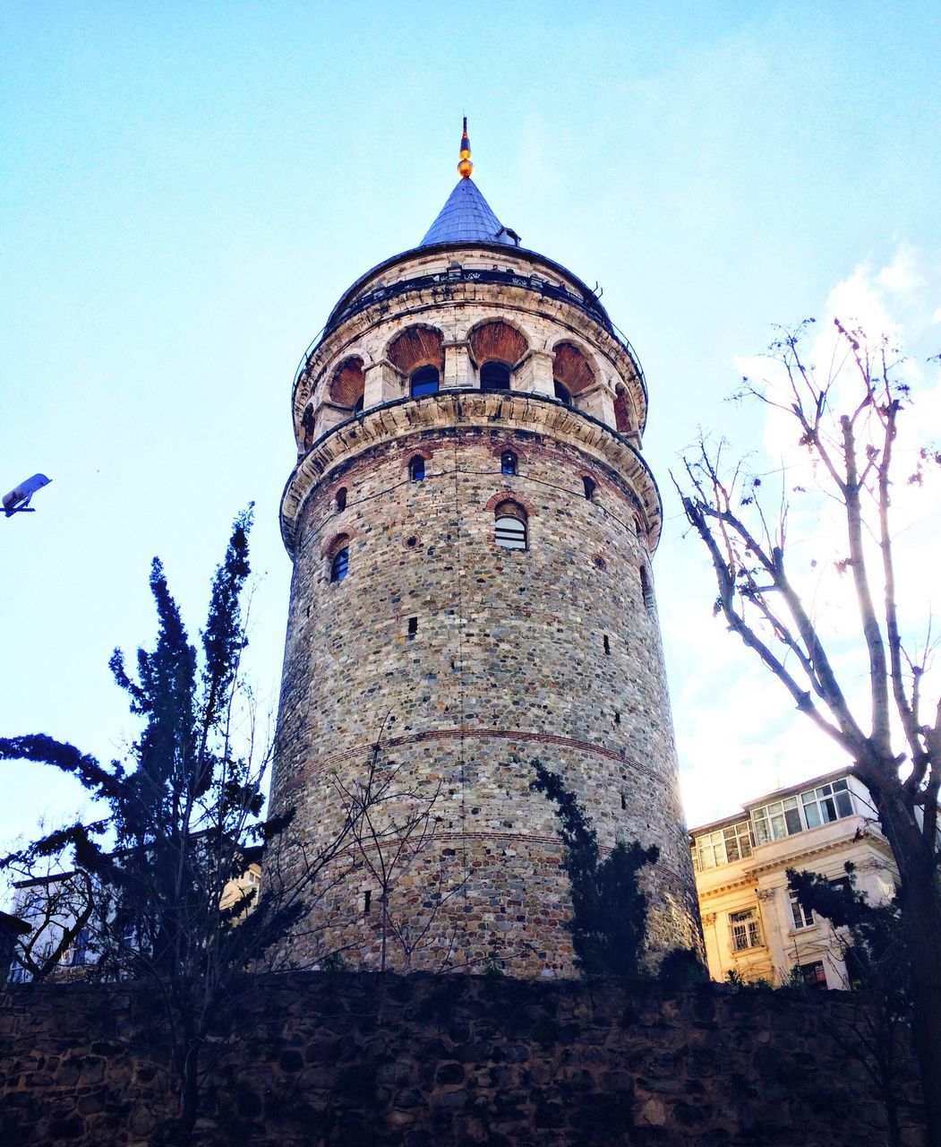 architecture, built structure, building exterior, low angle view, tower, sky, clear sky, day, outdoors, city, no people, travel destinations, dome, tree