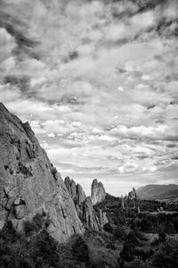 Scenic view of mountains against cloudy sky