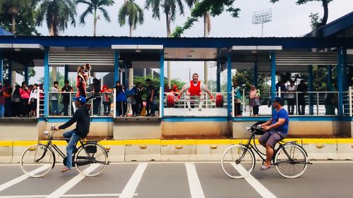 People riding bicycle in city