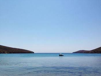 Scenic view of calm sea against clear sky