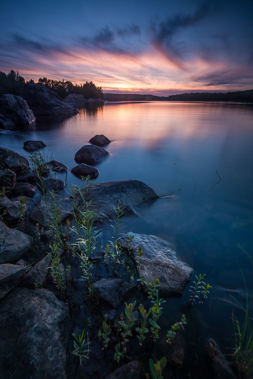 SCENIC VIEW OF SEA AT SUNSET