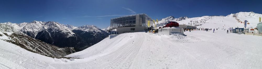 Panoramic view of snowcapped mountain against sky