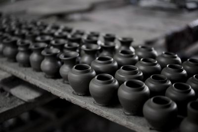 High angle view of clay pots arranged on table