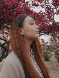 Portrait of young woman looking at camera