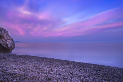 Scenic view of sea against cloudy sky