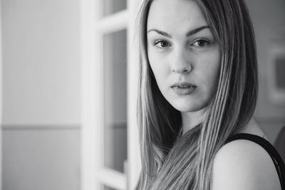 Close-up portrait of smiling young woman