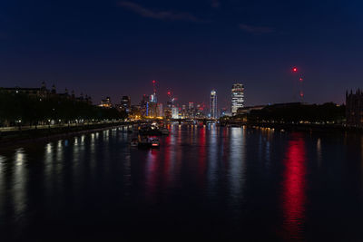 Illuminated buildings in city at night