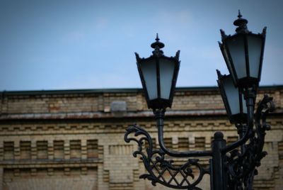 Low angle view of street light against sky