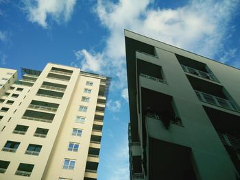 Low angle view of office building against sky