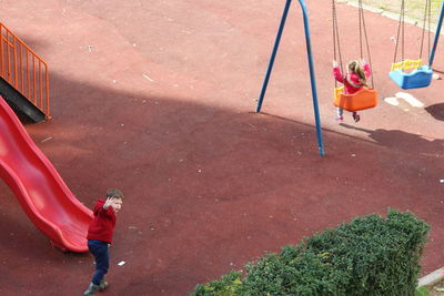 High angle view of child playing on playground