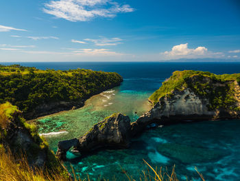 Scenic view of sea against cloudy sky