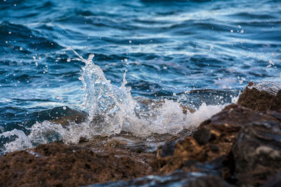 Waves splashing on rocks