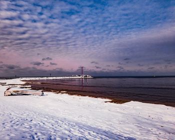 Scenic view of sea against sky during winter