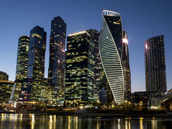 Illuminated buildings in city at night