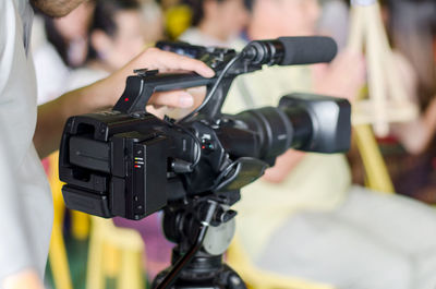 Close-up of hand holding camera