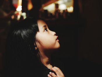 Side view of girl looking away