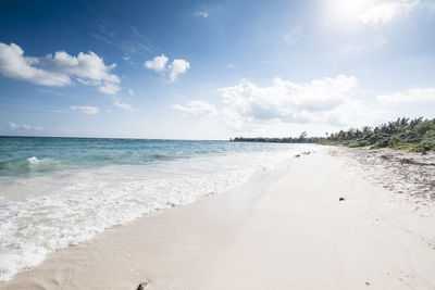 View of beach against cloudy sky