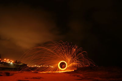 Low angle view of firework display at night