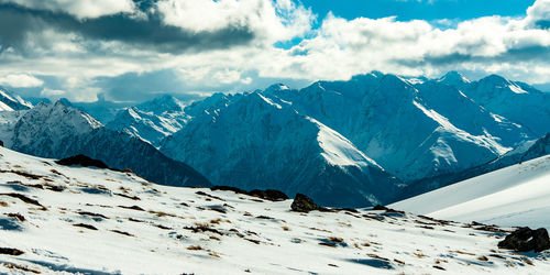 Scenic view of mountains against sky during winter