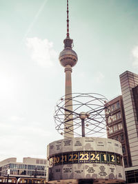 Low angle view of communications tower against sky