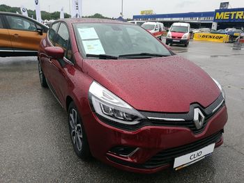 Close-up of car parked on road