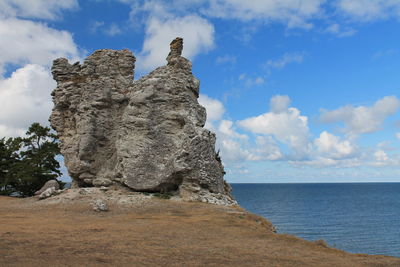 Scenic view of sea against cloudy sky