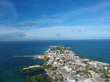 High angle view of sea and buildings against sky