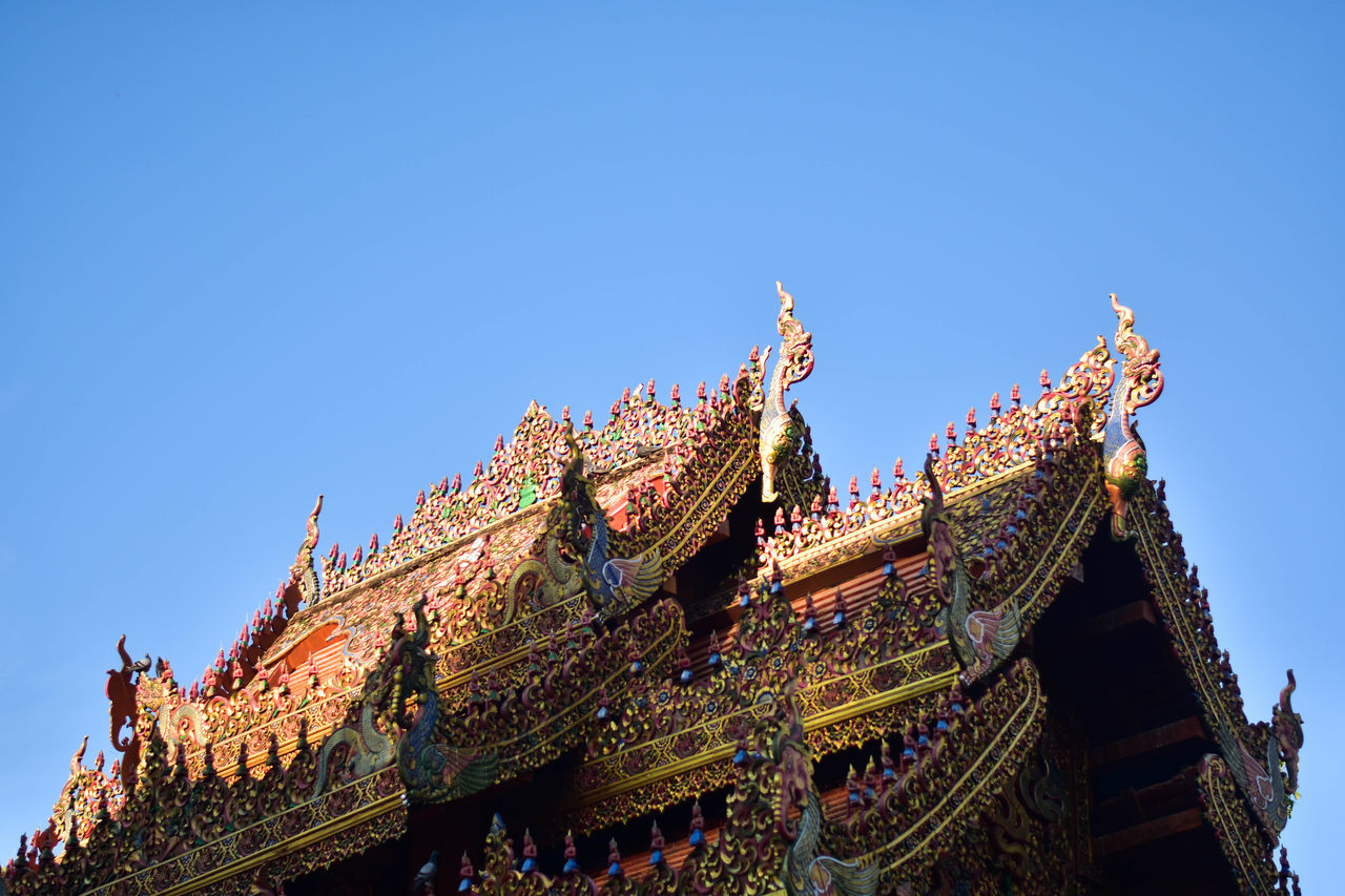 architecture, sky, built structure, temple, religion, temple - building, landmark, travel destinations, history, blue, the past, building exterior, building, belief, nature, travel, clear sky, tradition, place of worship, tower, no people, spirituality, ancient, chinese architecture, low angle view, tourism, pagoda, outdoors, roof, city, ornate, culture, craft, mansion, sunny, historic site