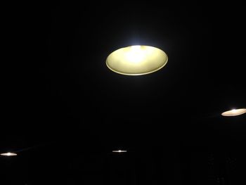 Low angle view of lamp post at night