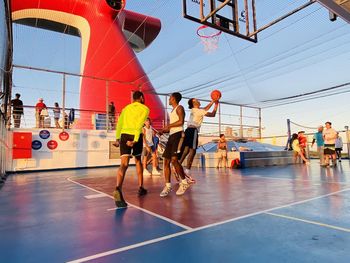 People playing basketball court