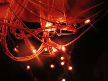 Low angle view of illuminated lighting equipment