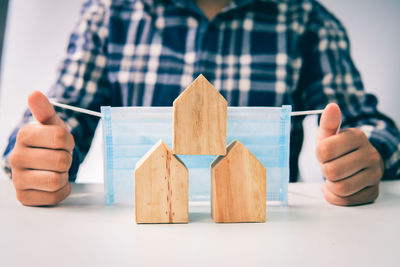 Close-up of man holding table