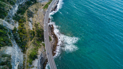 High angle view of sea by cliff