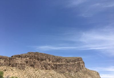 Low angle view of rock formations against sky