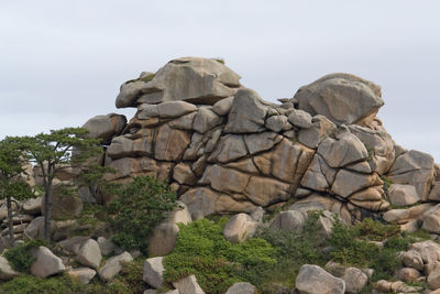 Rock formation on land against sky