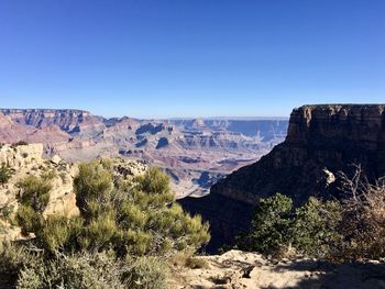 Scenic view of landscape against clear blue sky