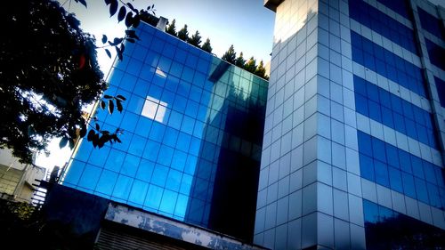 Low angle view of office building against sky