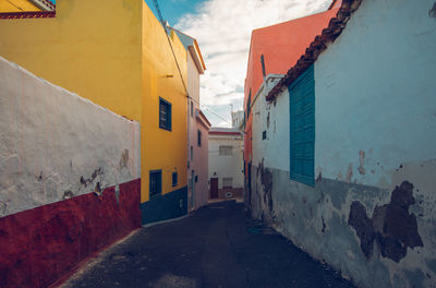 Street amidst buildings against sky