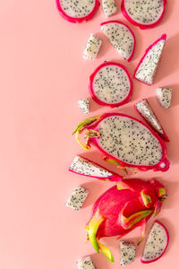 Directly above shot of food on pink background