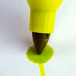 Close-up of yellow bell against white background