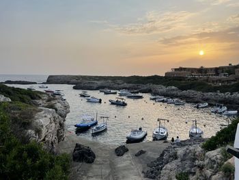 High angle view of sea shore against sky during sunset. menorca-spain