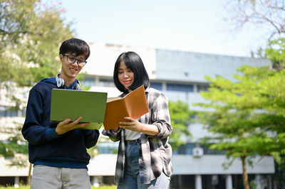 Side view of woman using digital tablet