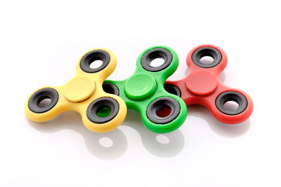 High angle view of multi colored pencils against white background